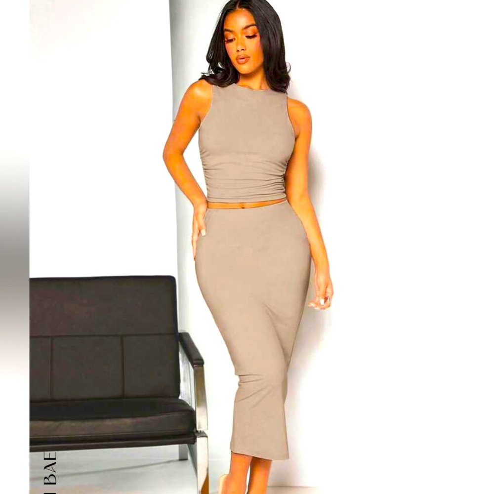 Gorgeous top and bottom tan skirt and crop top. Size medium.